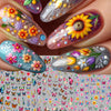 Close-up of fingernails decorated with colorful flower and butterfly nail stickers for DIY decoration