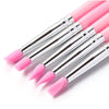 A set of pink silicone nail art brushes with silver handles and pointed tips.