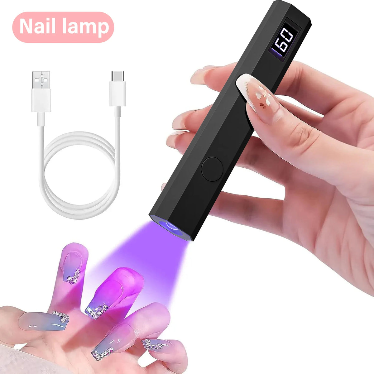 A hand holds a black nail lamp device, emitting purple UV light onto fingernails for drying or curing.