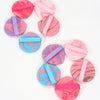 A set of six pink and purple air cushion beauty puffs with pink and purple accents.