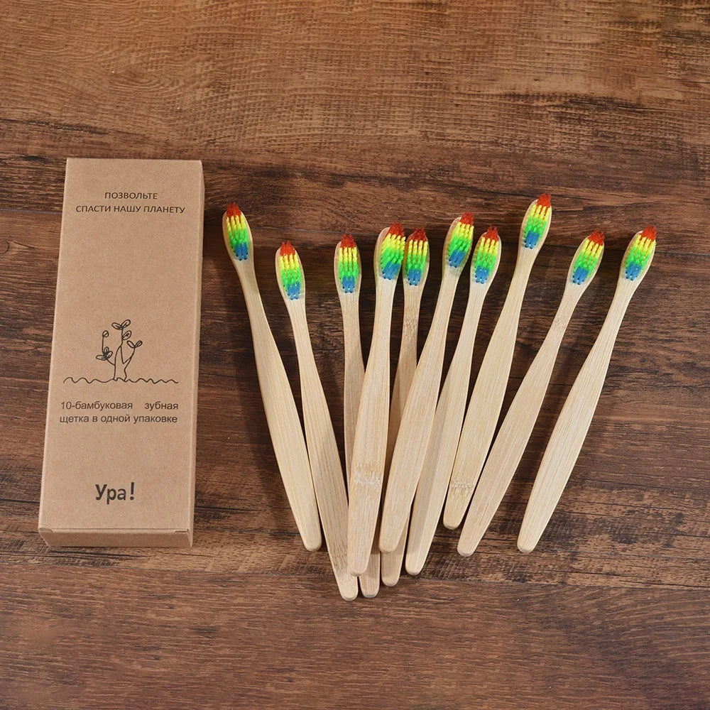 A set of ten natural bamboo toothbrushes packaged in a cardboard box.