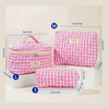 Three sizes of pink quilted cotton makeup bags labeled M L and S displayed on white boxes.
