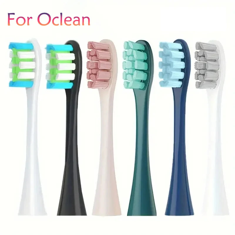 A set of replacement brush heads for sonic toothbrushes in various colors including green, pink, and blue.