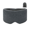 Un masque de sommeil en coton gris et une pochette à cordon noir.