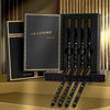 A set of black and gold soft bristle toothbrushes displayed in a dark box with a label for daily oral care.