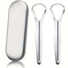 A set of stainless steel tongue scrapers, including a flat scraper and two curved scrapers.