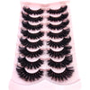 A set of natural mink striped false eyelash extensions displayed on a pink plastic tray.