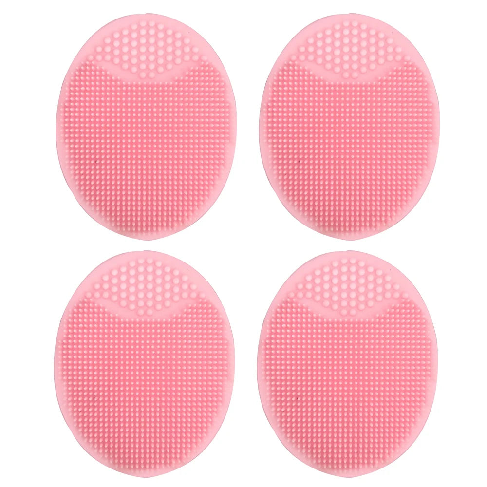 Four pink silicone facial cleansing brushes with textured surfaces for deep pore exfoliation