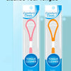 Tube clair de nettoyant pour la langue en silicone avec poignée rose et boucle orange, pour une haleine fraîche.