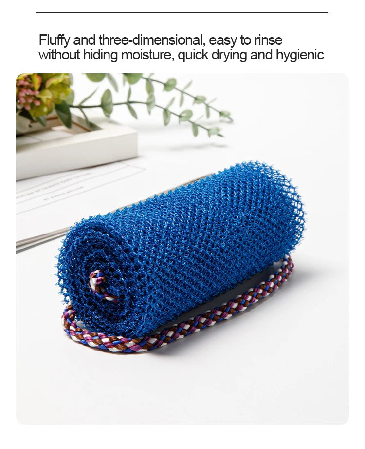 A rolled blue exfoliating sponge with a purple and white striped band is shown on a white surface.