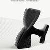 A black silicone facial cleaning brush is shown against a white textured background.