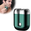 A sleek, dark green cordless electric razor shaver is shown next to a man using it on his face.