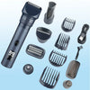A collection of various grooming attachments and a main body of a dark blue electric beard trimmer.