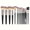 A collection of various makeup brushes with tapered handles and soft bristles arranged in a row.