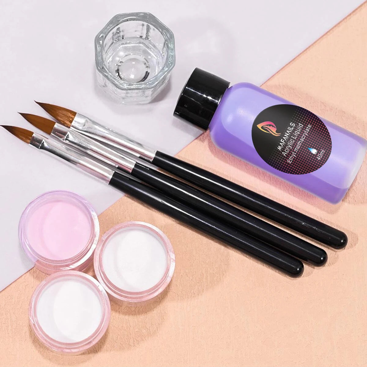 A professional acrylic nail powder kit featuring a purple bottle of monomer liquid and several brushes on a beige surface.