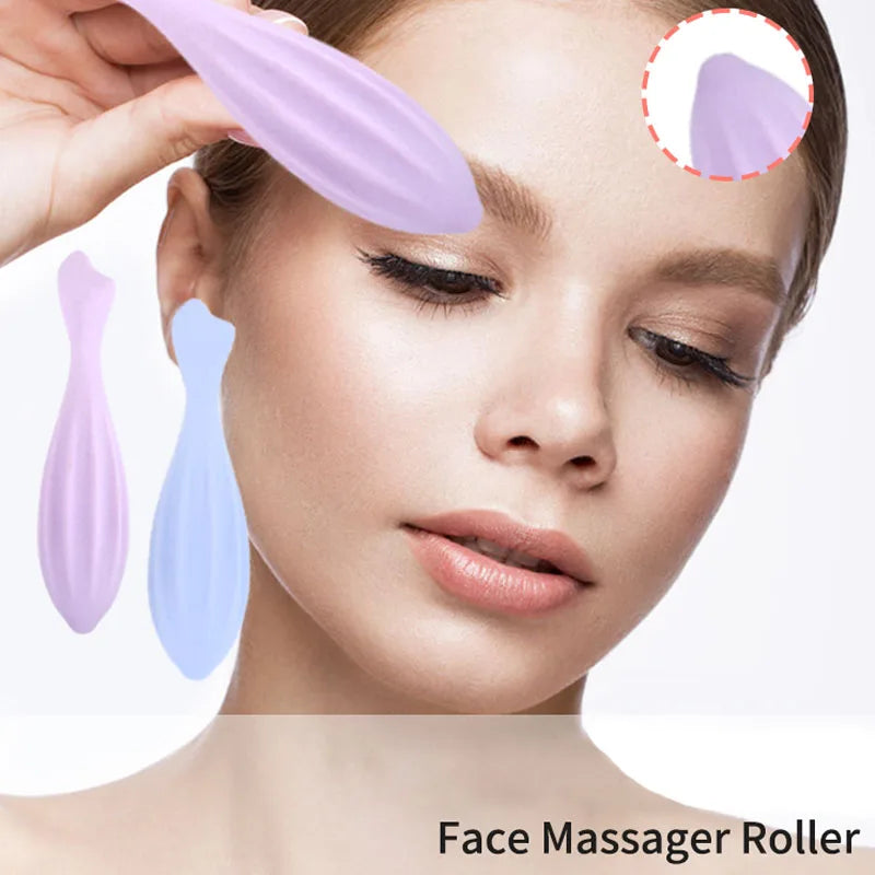A woman is using a silicone face massager roller in various shades of purple and blue for facial massage.