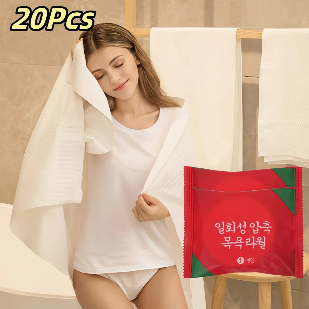 A woman is wearing a white t-shirt and underwear while holding a red and green individually wrapped towel.