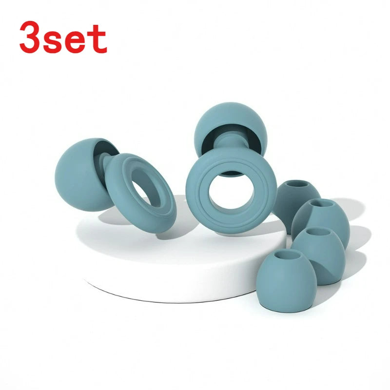 A set of three light blue silicone ear plugs for sleep and protection displayed on a white surface.
