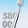 A close-up view of a silver electric toothbrush with bristles, showing high frequency penetration details.