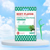 Une boîte de ficelle dentaire professionnelle au goût menthe avec un flosser en plastique vert visible à côté.