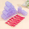 A set of purple and pink self-grip hair rollers for creating heatless curls and volume.
