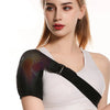 A woman is wearing a black USB heated shoulder massage belt on her arm.