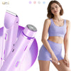 A woman is holding a purple electric body hair trimmer and a grooming tool against a white background.