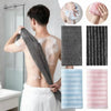A person is using a Japanese exfoliating body scrubber loofah to cleanse their back under a shower.