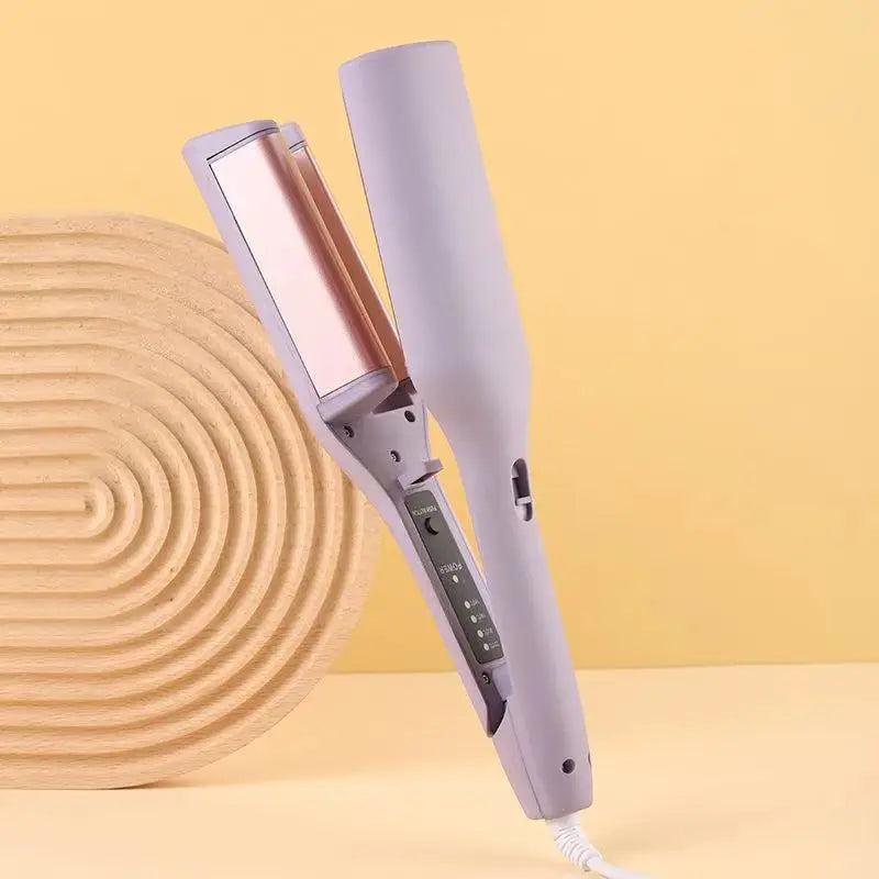A purple electric curling iron with a heated barrel is shown against a light yellow background.
