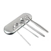 Stainless steel U-shaped tongue scraper resting on a rectangular holder.