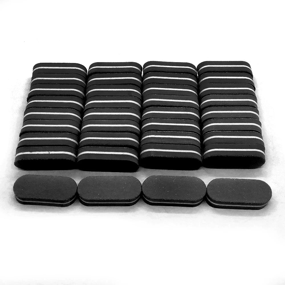 A row of black and white nail buffing blocks arranged in rows.