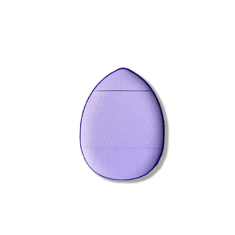 A purple mini finger puff foundation applicator tool with a rounded, oval shape.