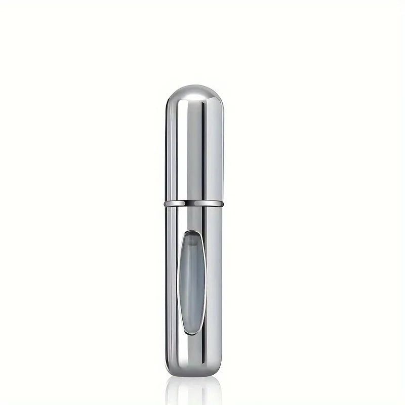 A sleek, cylindrical silver perfume atomizer bottle with a clear window is shown against a white background.
