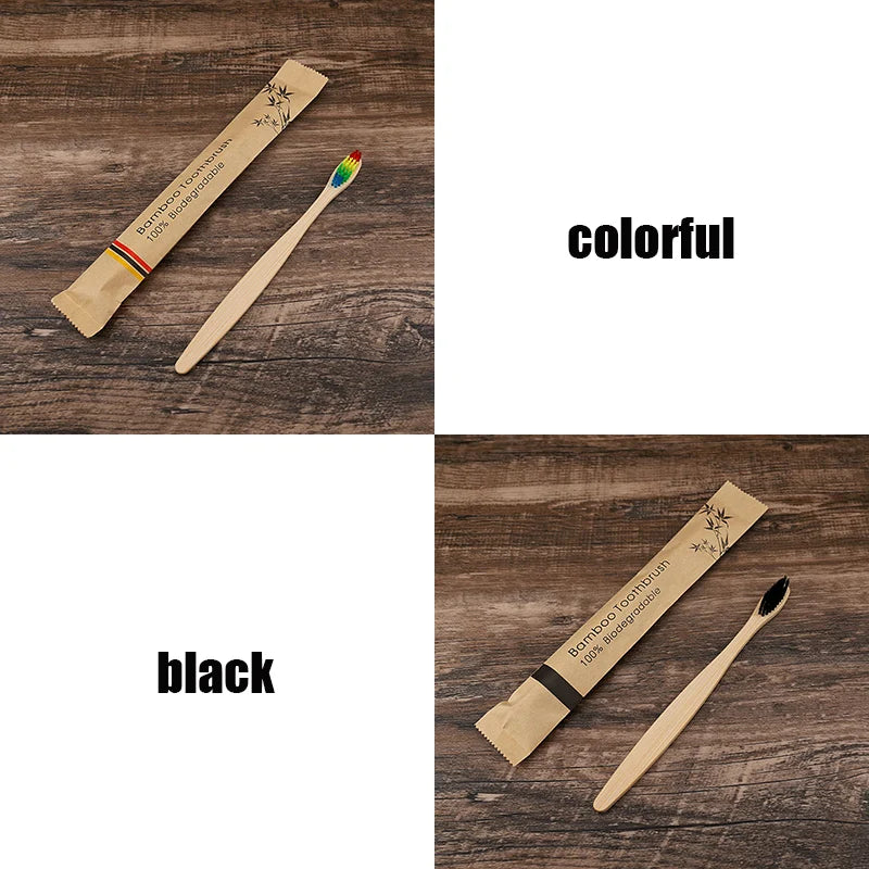 A set of bamboo toothbrushes, one colorful and one black, displayed on a wooden surface.