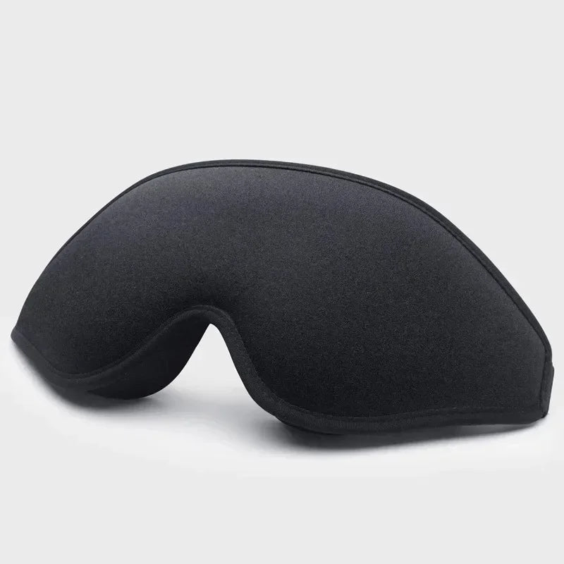 A black comfortable 3D sleeping eye mask shown from the side.