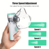 A hand holds a clear portable mesh inhale nebulizer device demonstrating three speed adjustments.