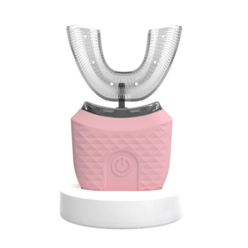A pink ultrasonic electric toothbrush with a clear silicone head mounted on a white base.