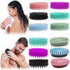 Collection de gants de douche en silicone à double face dans diverses couleurs : rose, violet, bleu sarcelle, vert et noir.