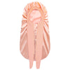 A peach-colored satin silk hair bonnet cap shown flat.