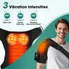 A person is using an electric shoulder heating and vibration massager on their shoulder.