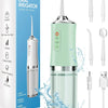 A portable electric water flosser in light green and silver is shown with various tips and accessories.