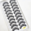A tray of natural 3D mink false eyelashes displayed in a white plastic container.