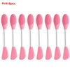 Ocho brochas de silicona rosa para limpiar y mascarillas faciales, mostradas una al lado de la otra.