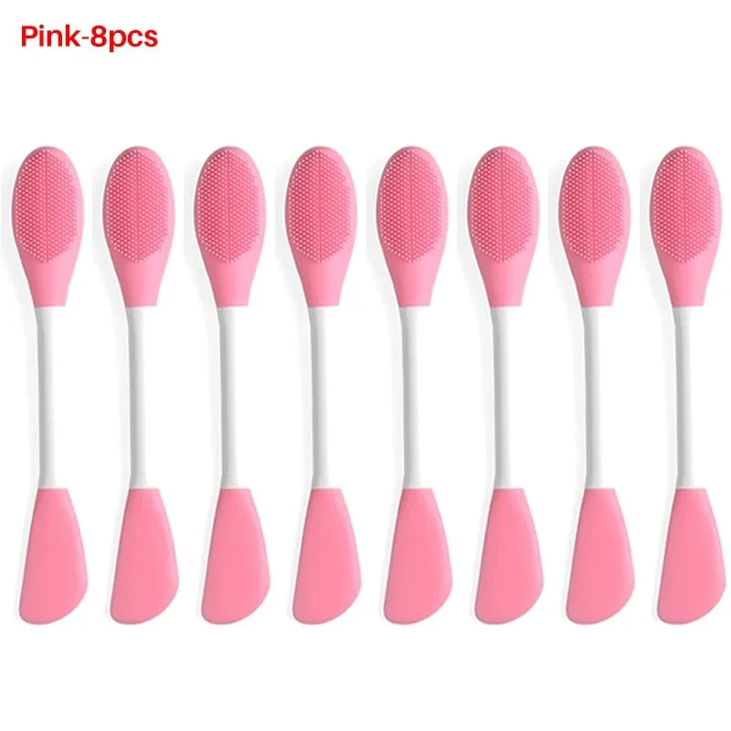 Ocho brochas de silicona rosa para limpiar y mascarillas faciales, mostradas una al lado de la otra.