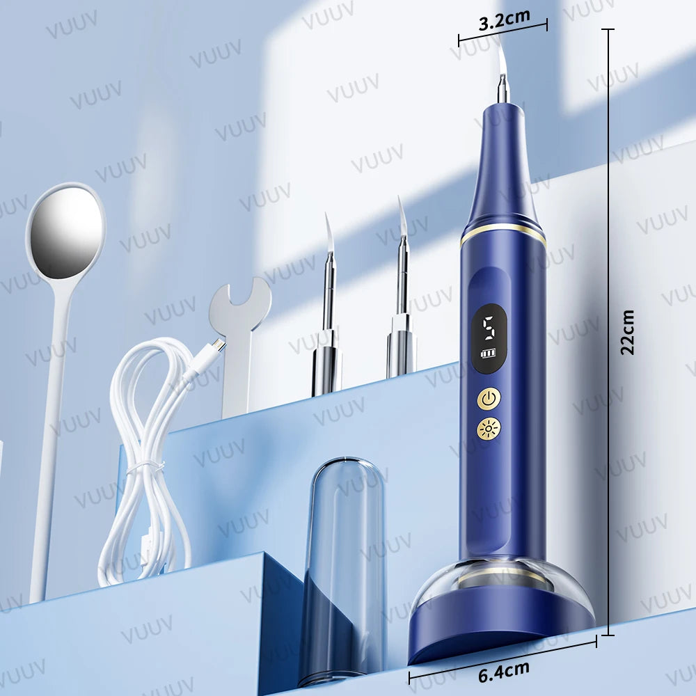 A blue ultrasonic dental scaler tool is shown next to various dental instruments and measuring tools.