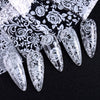 Un ensemble de décals de vernis en dentelle noir et blanc, avec diverses formes pour les ongles.