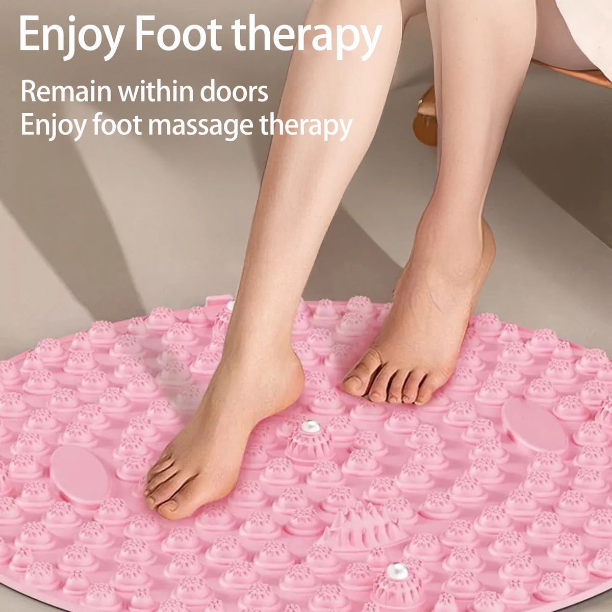 A person's feet are placed on a pink magnetic foot massage mat for foot therapy.