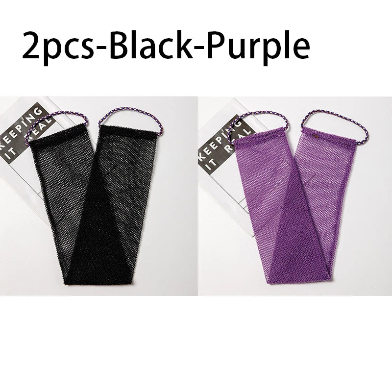 Two exfoliating African net body scrub sponges in black and purple.