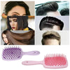 A set of purple and pink professional detangling hair brushes shown in various angles.