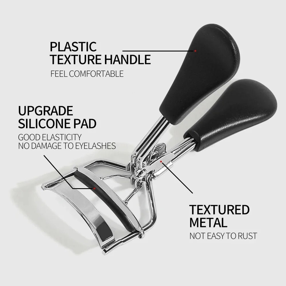 A close-up of a metal eyelash curler with a black plastic texture handle and silicone pad.